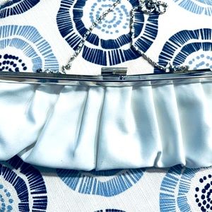White satin clutch silver clasp excellent condition. Essentials only.